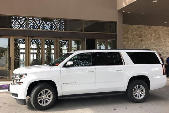 White Suburban Luxury SUV at hotel lobby | Cabo Airport Transportation